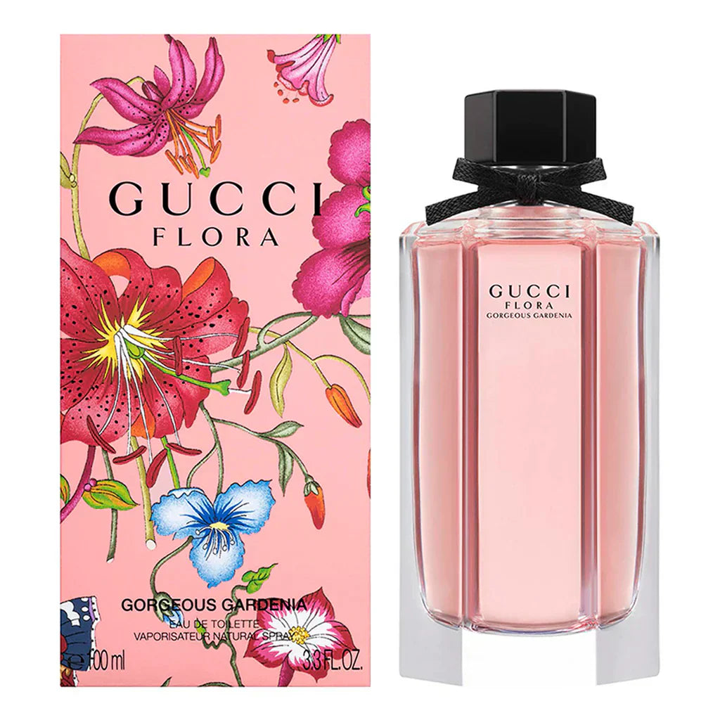 Gucci Flora perfume bottle and packaging with floral design on a pink background